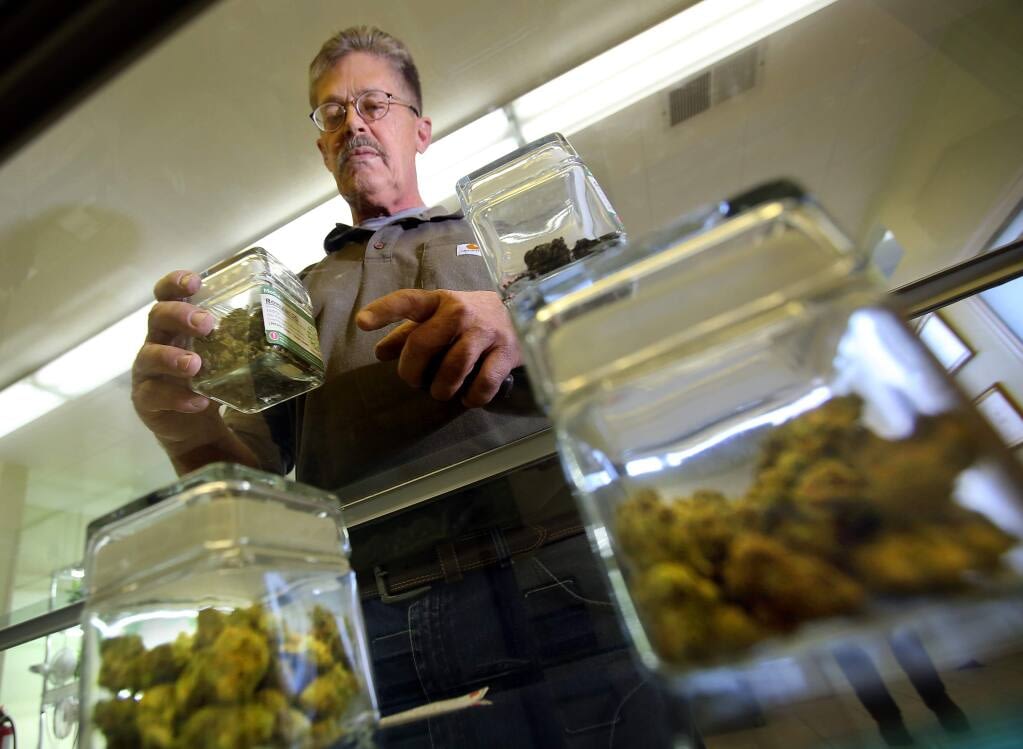 tending-dispensary-counter cannabis jars on counter